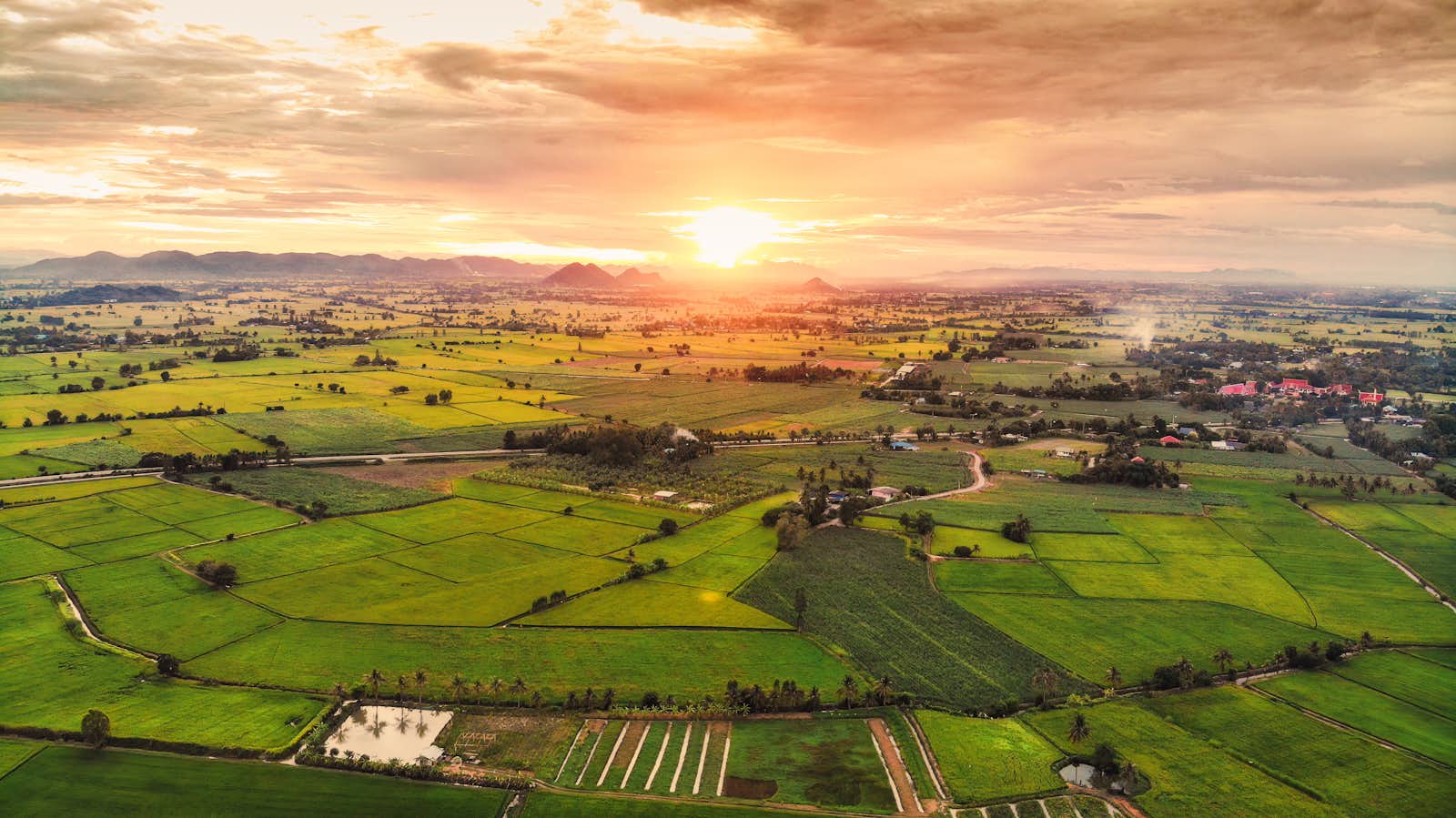 sunset over land and farms